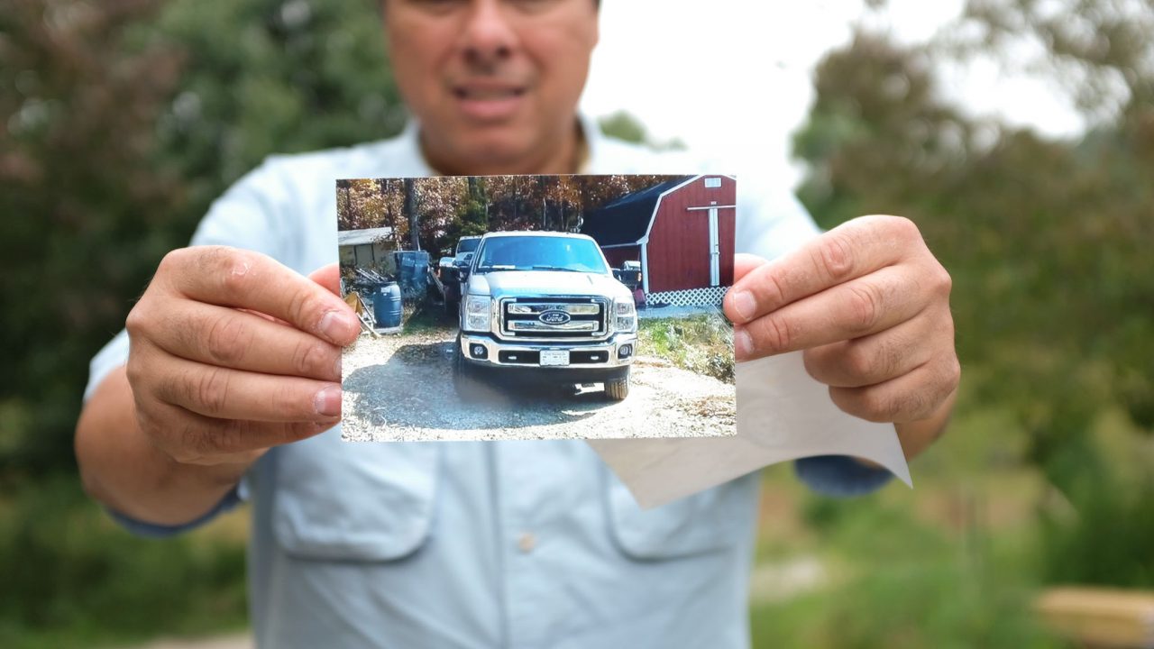 Gerardo Serrano holds up a photo of his truck, which is at the center of the legal dispute being appealed to the U.S. Supreme Court. The U.S. Customs and Border Protection (CBP) agency seized and held his truck for over two years never granting him a hearing after finding five low-caliber bullets (and no gun) he had mistakenly left in his vehicle. The CBP called the bullets 'munitions of war' as a justification for the seizure. (Photo courtesy of the Institute for Justicewww.ij.org.)