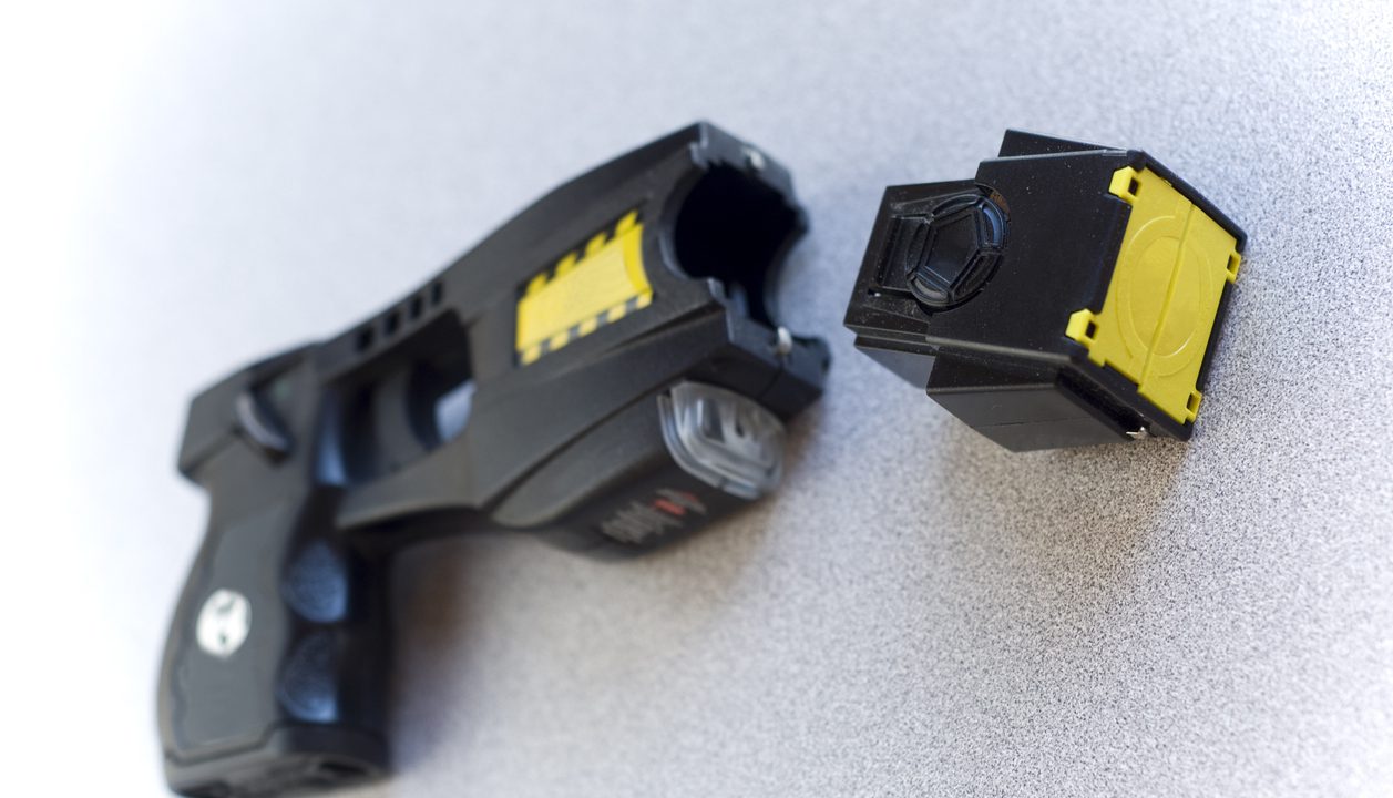 A police taser with copy-space.