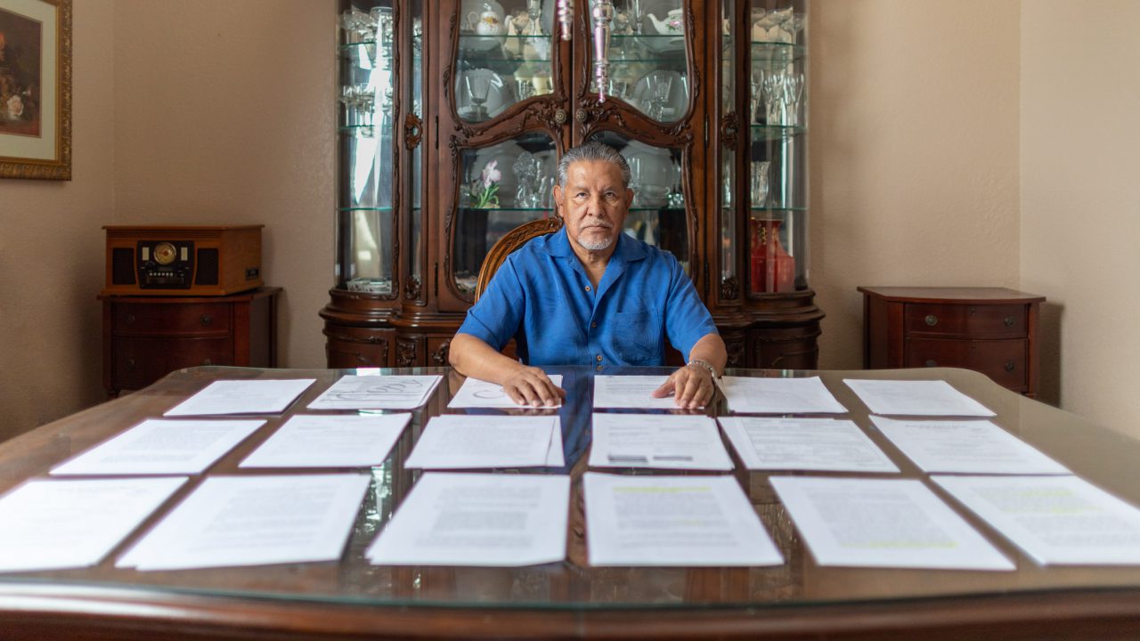 Vietnam Veteran José Oliva reviews documents from his lawsuit against federal officers who assaulted him in an unprovoked attack inside an El Paso, Texas Veterans Affairs hospital. He has appealed his case against the officers to the U.S. Supreme Court. (Photo by the Institute for Justice www.ij.org.)