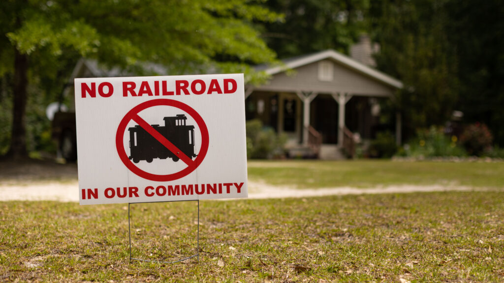 A 'No Railroads in Our Community' sign outside the home of Don and Sally Garrett in Sparta, Georgia.