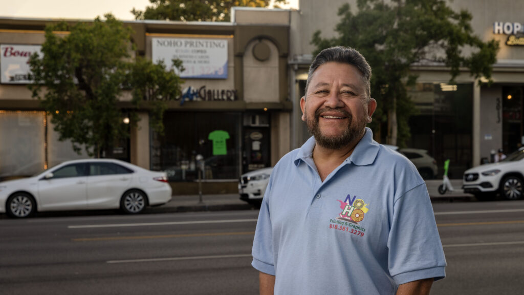 Carlos Pena stands outside his North Hollywood printing shop, which was destroyed by a LAPD SWAT team in August 2022. The city refused to compensate him for the damage.