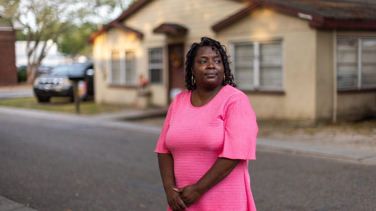 Faye Payton stands in front of her family's home in Ocean Springs.