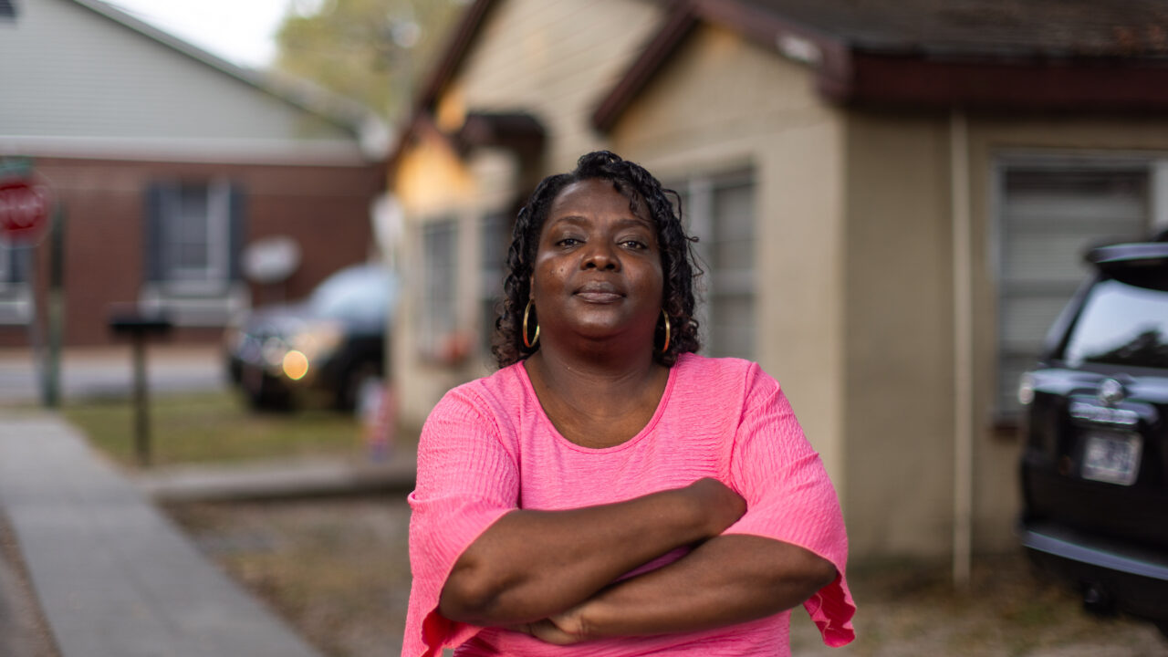 Faye Payton stands in front of her family's home in Ocean Springs.