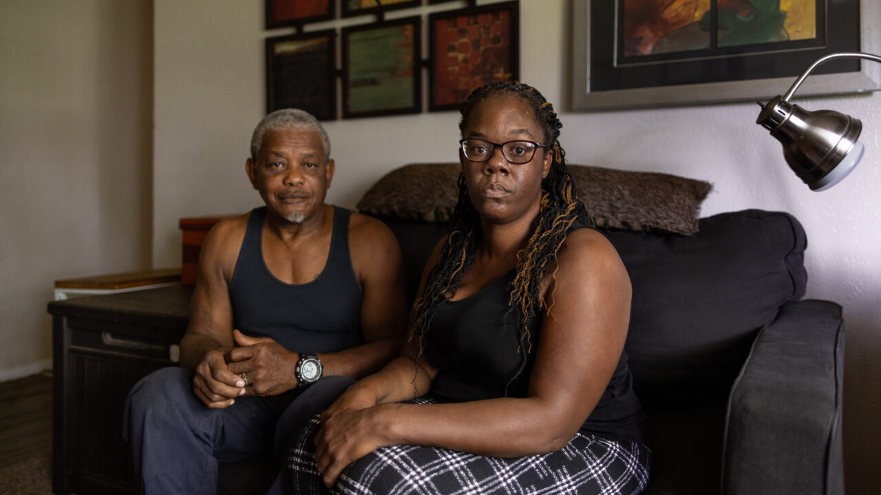 Karen Jimerson and James Parks sit inside their apartment in Dallas, Texas. The couple are asking the United States Supreme Court to hear their case challenging qualified immunity for a police officer who ordered a SWAT team to raid the wrong home.