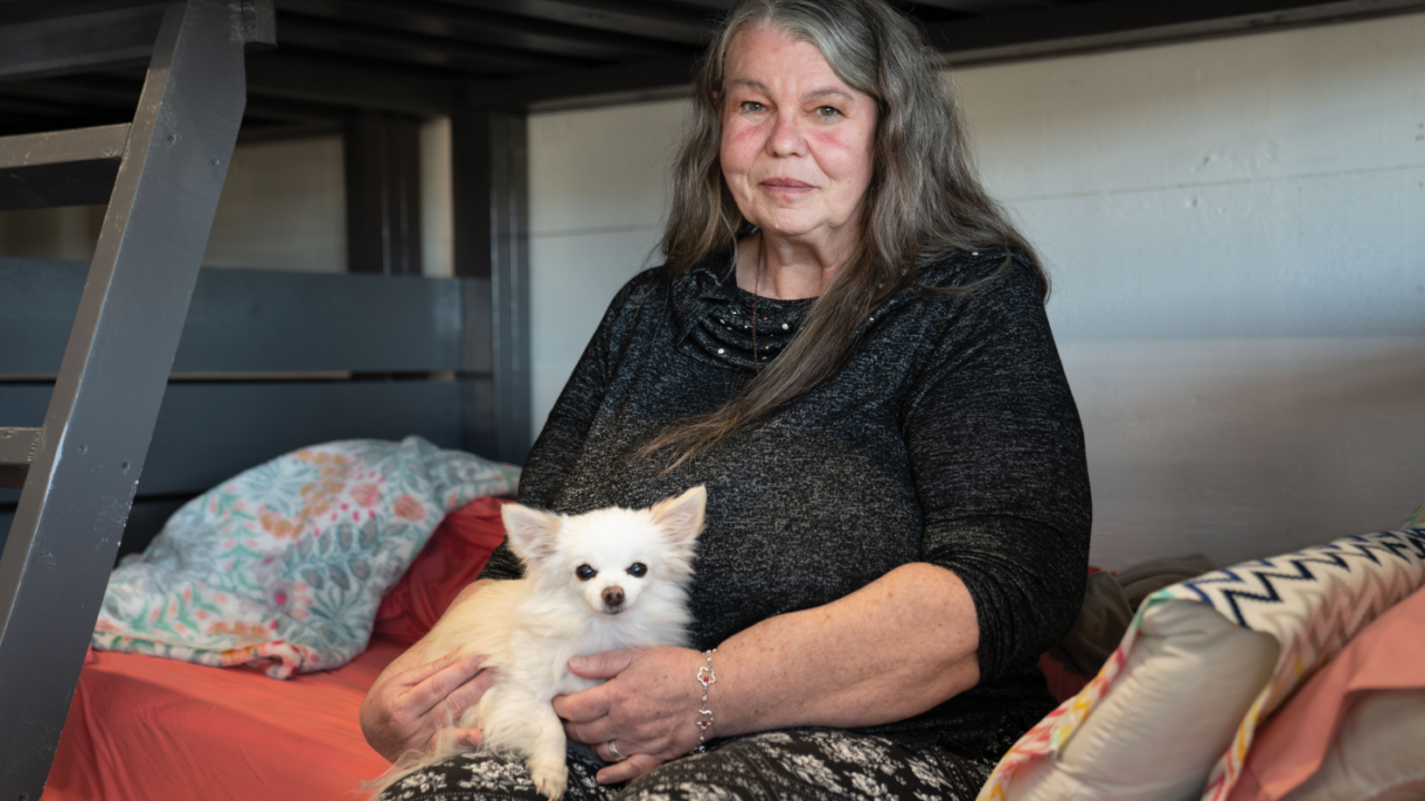 The Flathead Warming Center, run by executive director Tonya Horn, provides warmth, safety, and community for people in need, such as client Christine Nelson and her dog, Killer, who previously received help from the shelter.