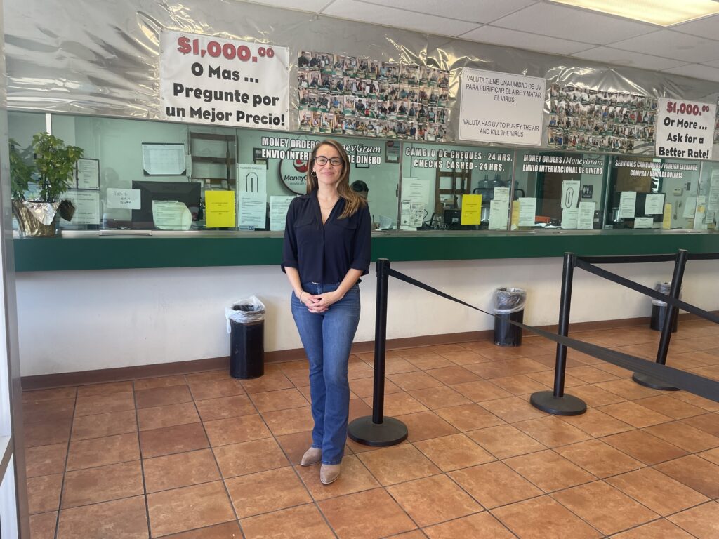 woman stands in front of counter