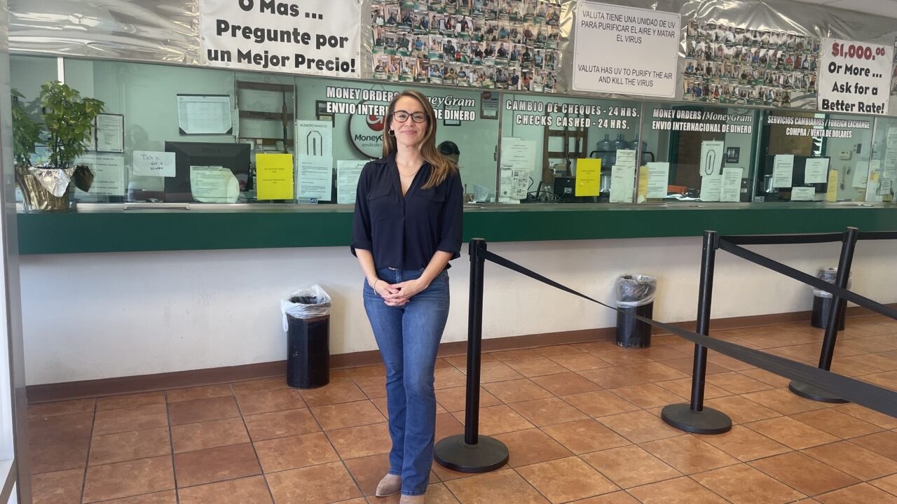 woman stands in front of counter