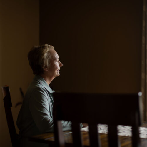 woman sitting at kitchen table