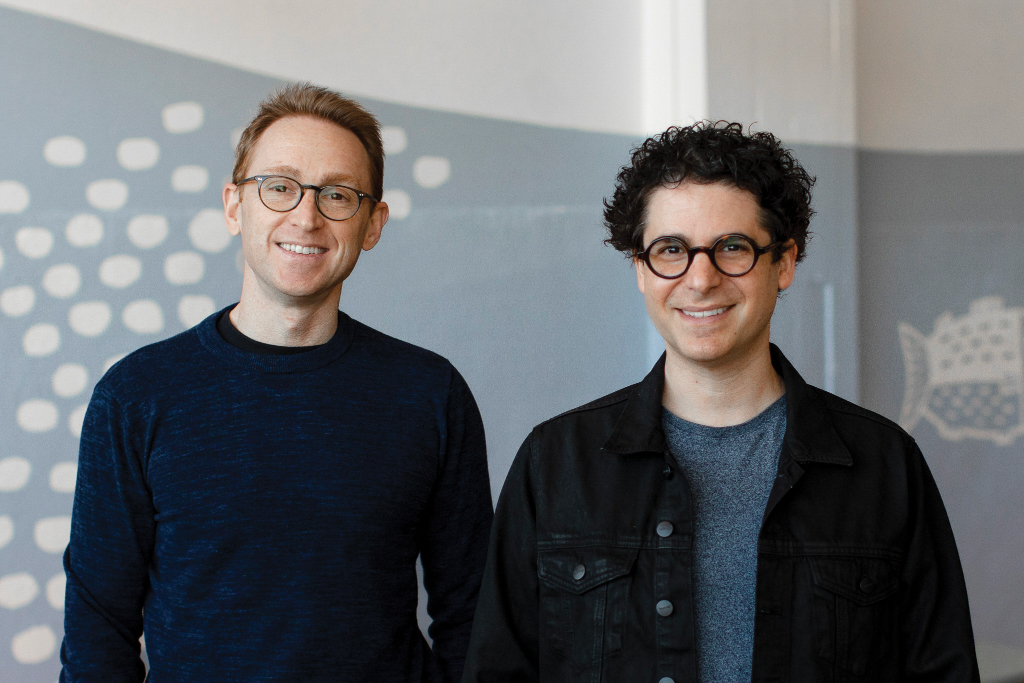 Wildtype co-founders Justin Kolbeck and Dr. Aryé Elfenbein smiling side by side indoors