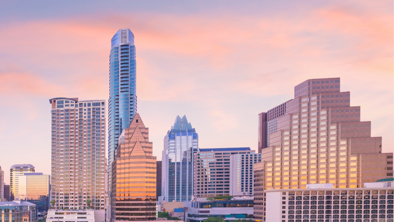 Downtown Austin skyline at dusk, including the Frost Bank Tower and Independent building