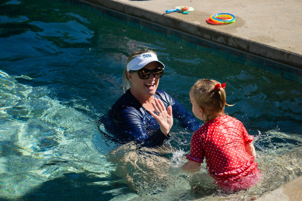 instructor and student in pool