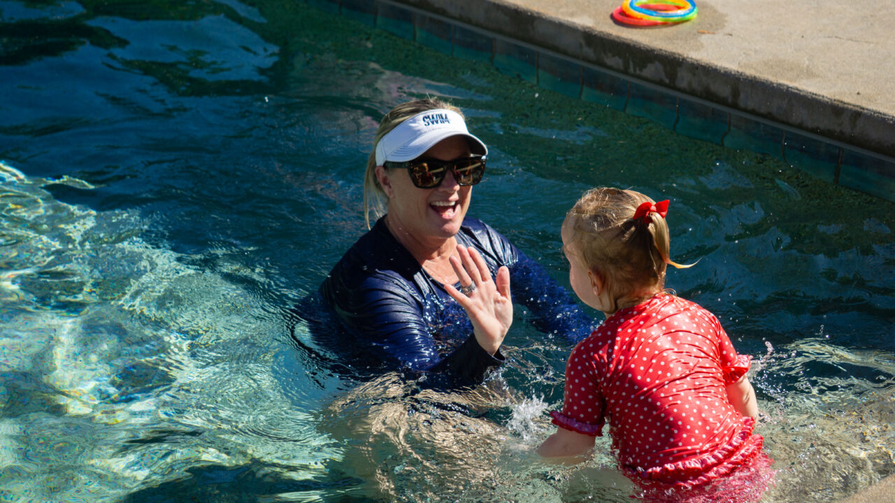 instructor and student in pool