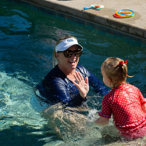 instructor and student in pool