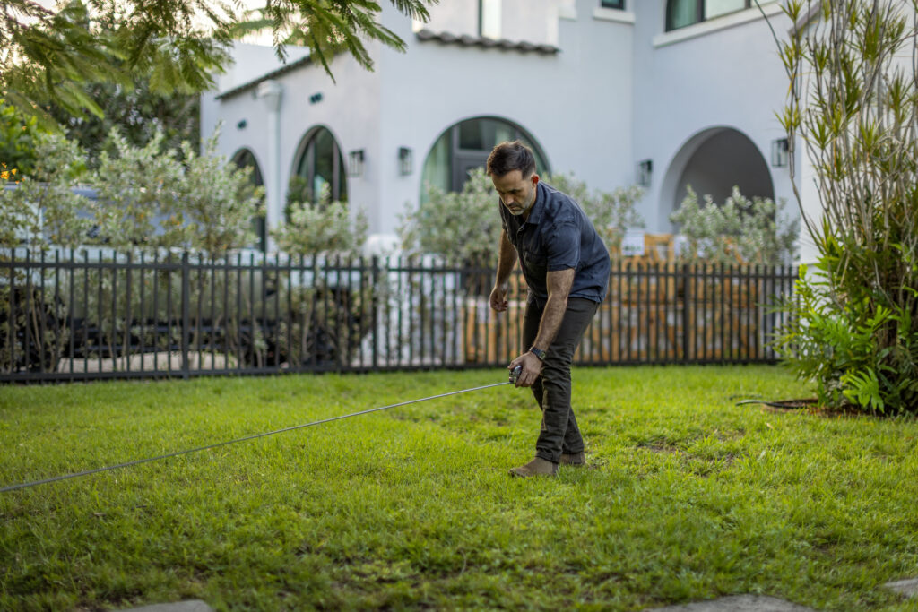 Chand standing on his front lawn.