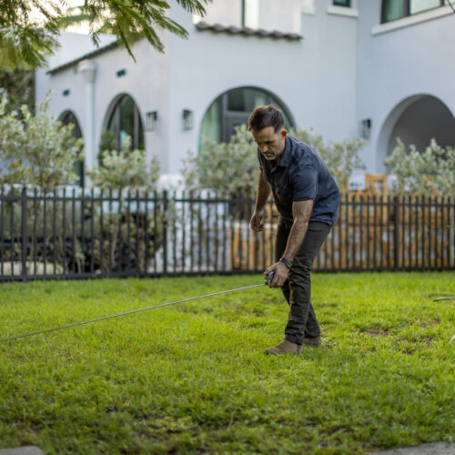 Chand standing on his front lawn.