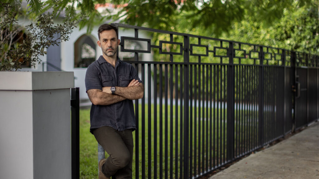 Chad standing in front of his house.