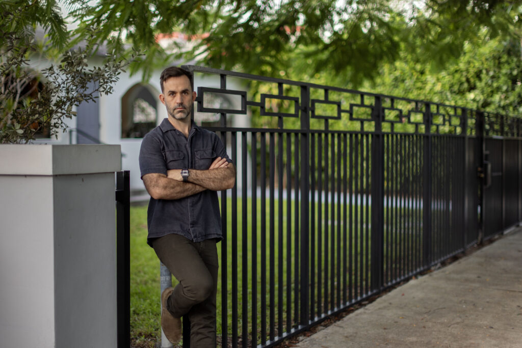 Chad standing in front of his house.