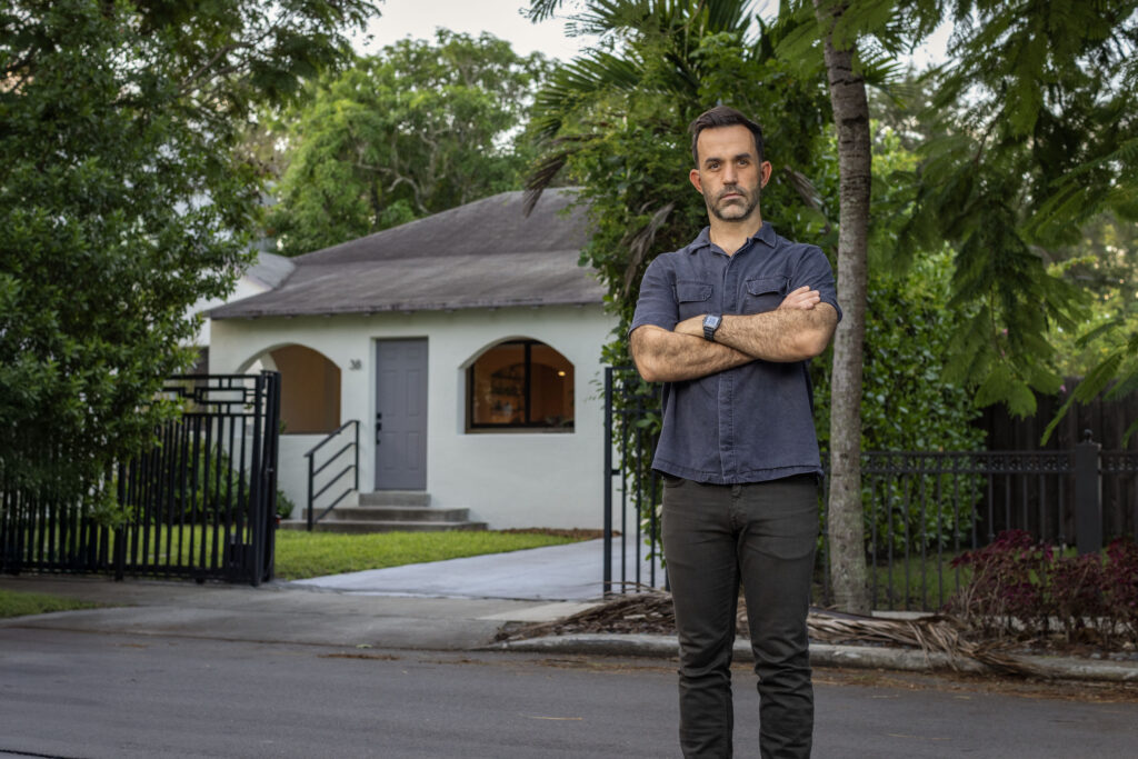 Chad standing in front of his house.