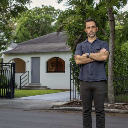 Chad standing in front of his house.
