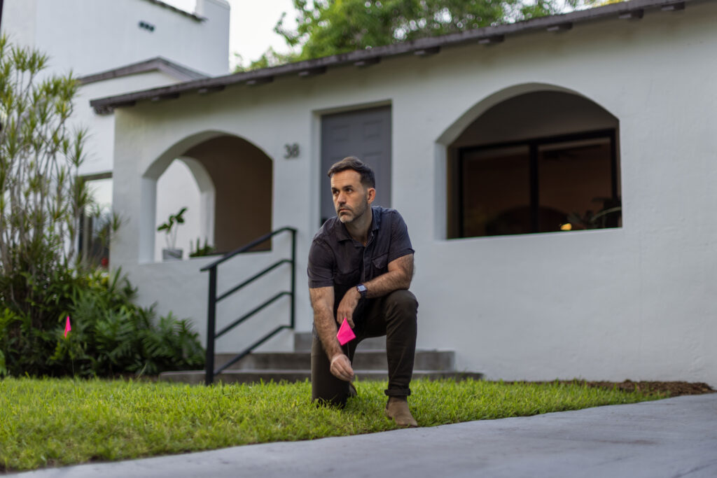 Chad standing in front of his house.
