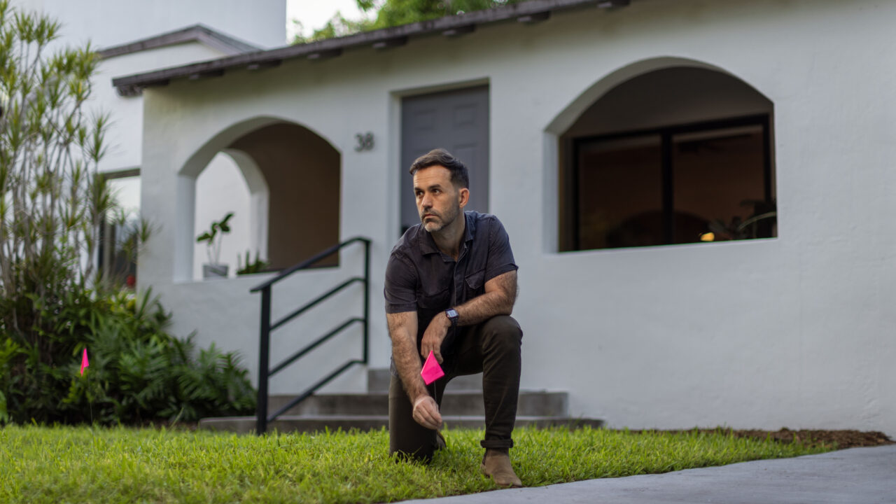 Chad standing in front of his house.