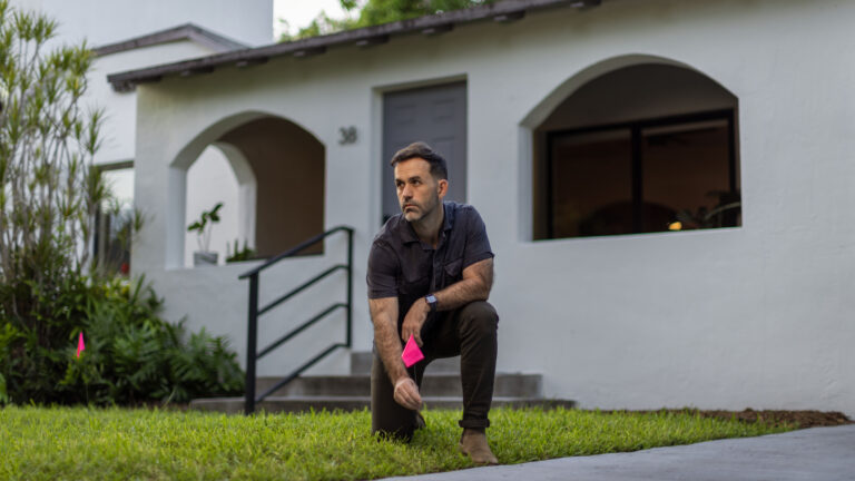 Chad standing in front of his house.