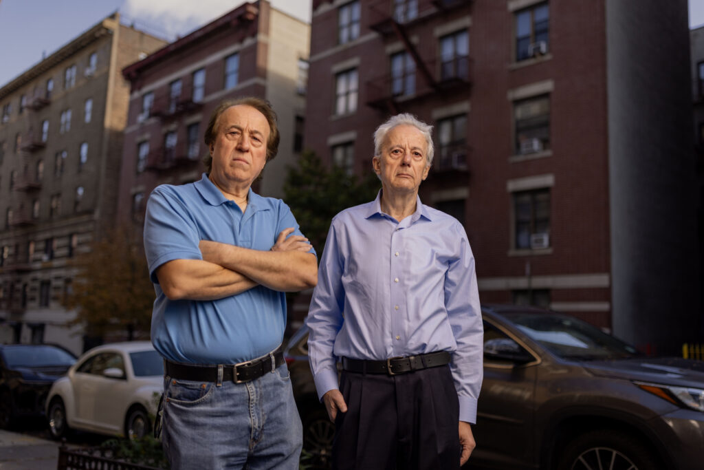Pashko and Tony Lulgjuraj standing on the street outside their apartment building.