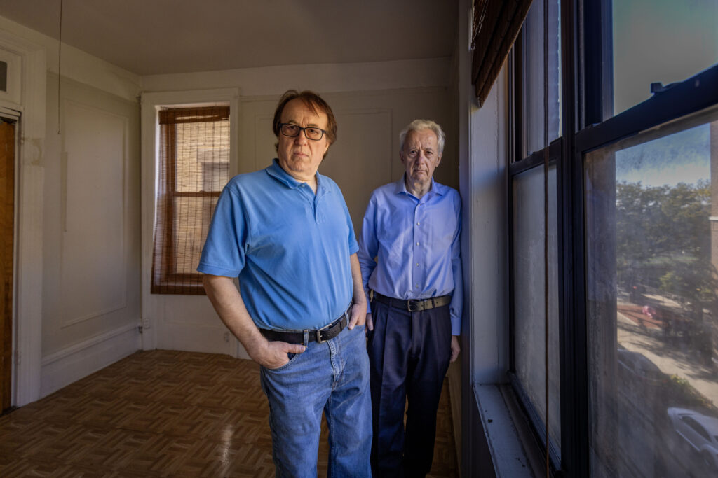 Pashko and Tony Lulgjuraj standing in an apartment building