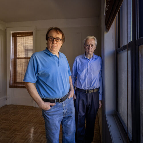 Pashko and Tony Lulgjuraj standing in an apartment building