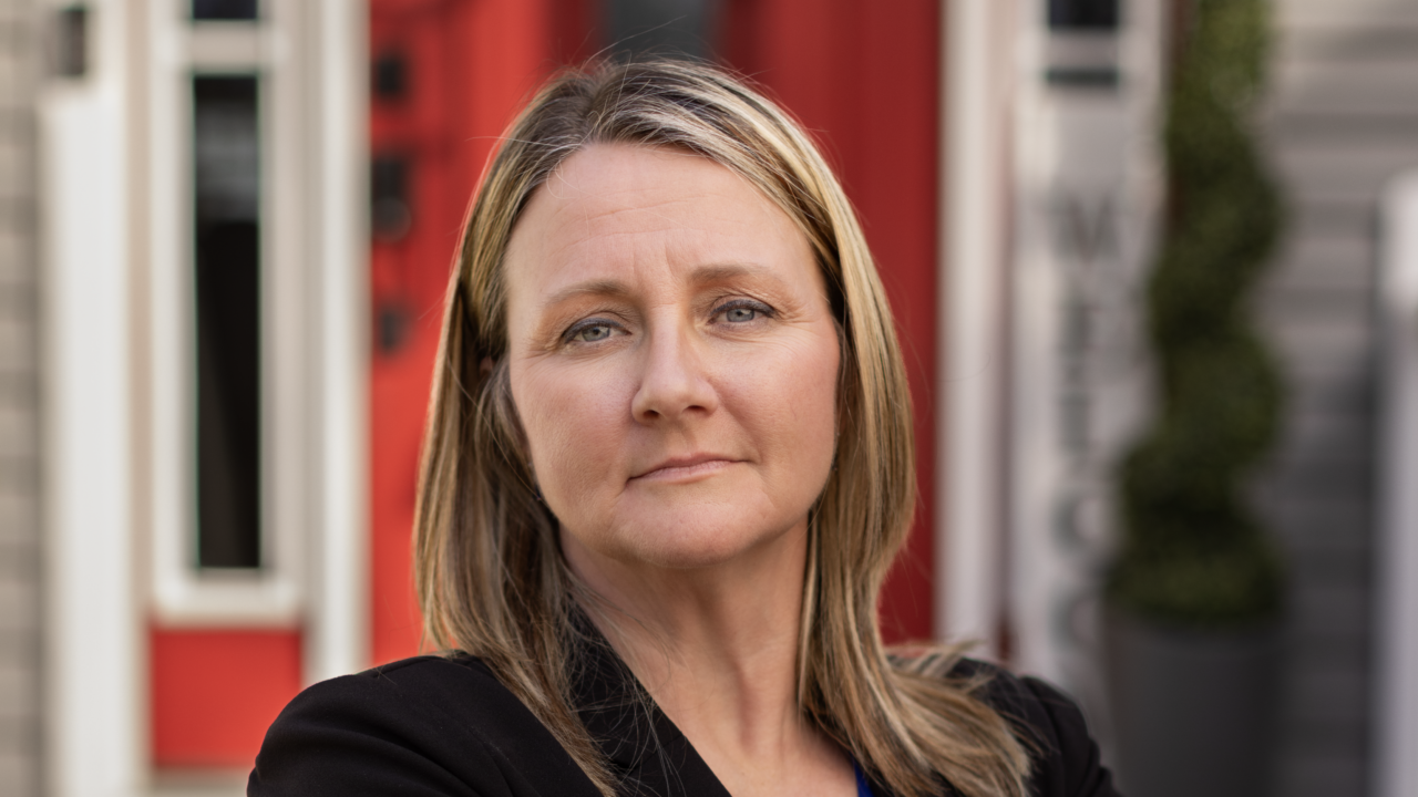 Melissa Brown stands outside, an IJ client in her economic liberty case