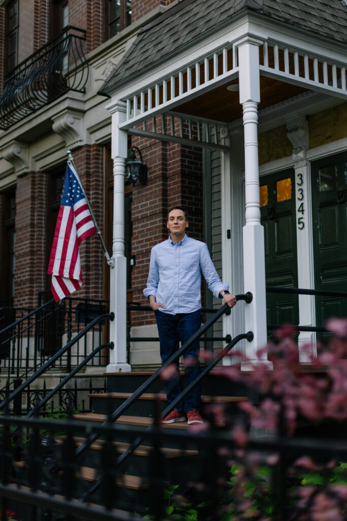 Leo Feler stands on the porch of his home in Chicago, which was warrantlessly raided by Customs and Border Protection officers in October 2025.