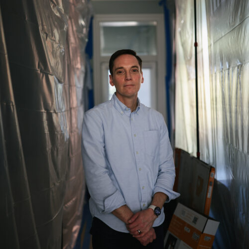 Leo Feler stands in a portion of his Chicago home that is still under construction. The home was warrantlessly raided by Customs and Border Protection officers in October 2025.