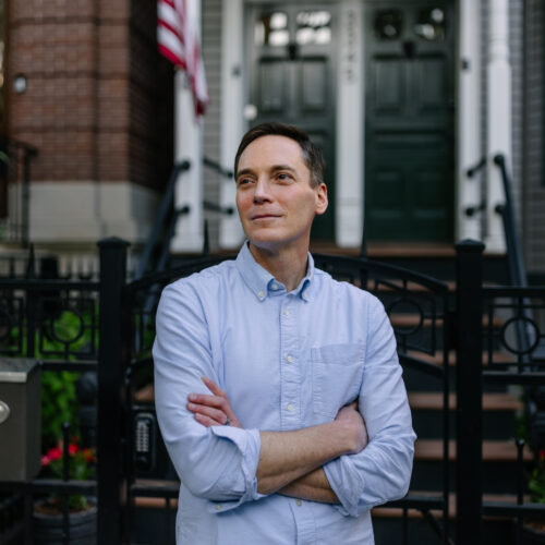 Leo Feler stands outside his home in Chicago, which was warrantlessly raided by Customs and Border Protection officers in October 2025.