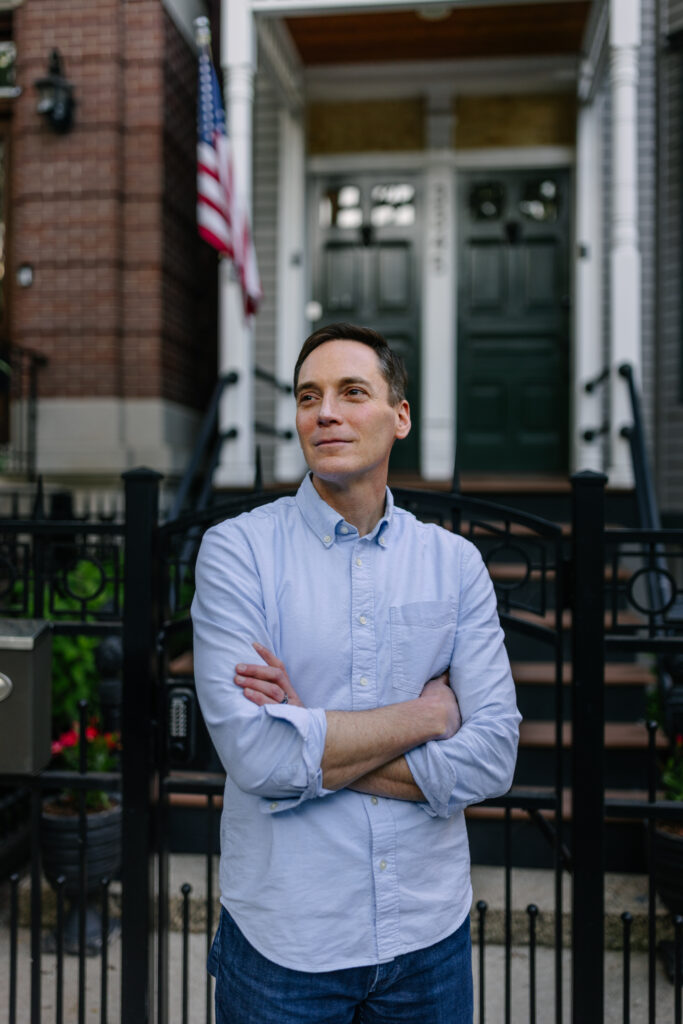 Leo Feler stands outside his home in Chicago, which was warrantlessly raided by Customs and Border Protection officers in October 2025.