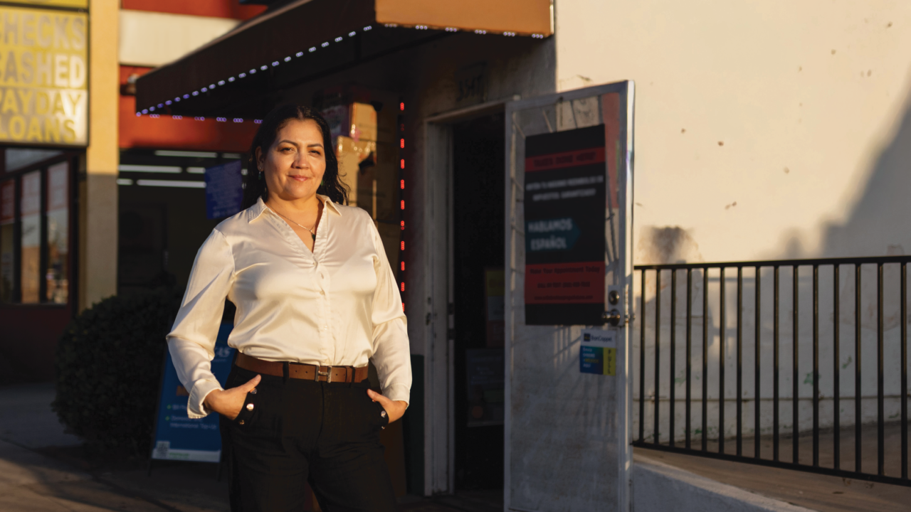 Esperanza Gomez stands outside her check cashing and payday loan storefront business