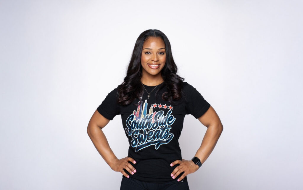 Cayla Williams smiles, hands on hips, wearing a South Side Sweats Chicago T-shirt