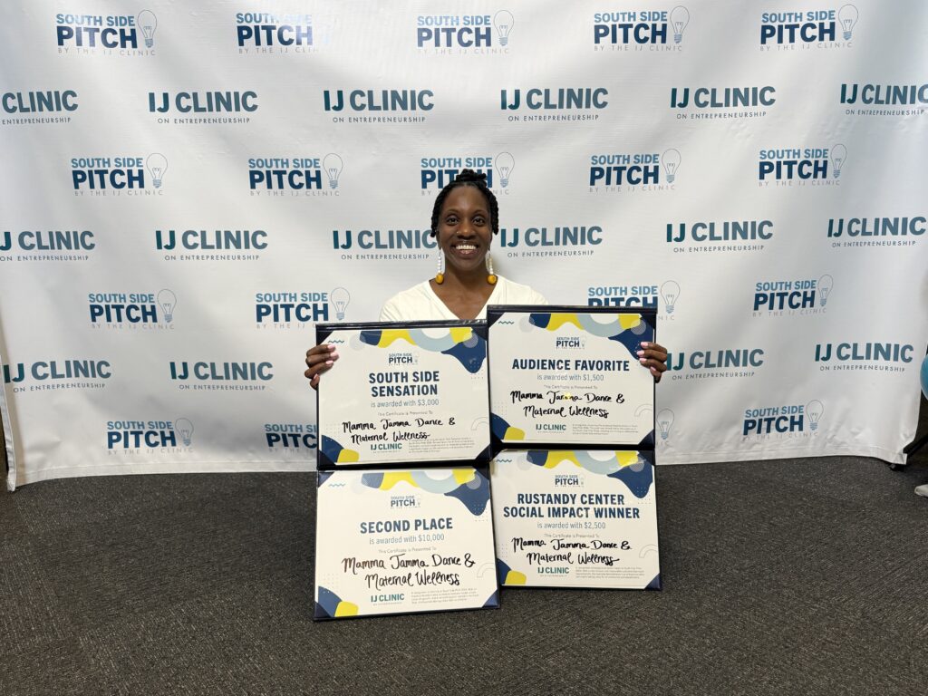 Woman holds four South Side Pitch award certificates for Mamma Jamma Dance & Maternal Wellness